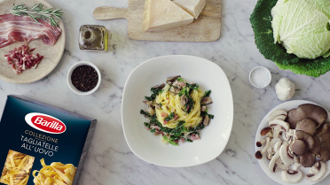 Tagliatelle met bacon en champignons